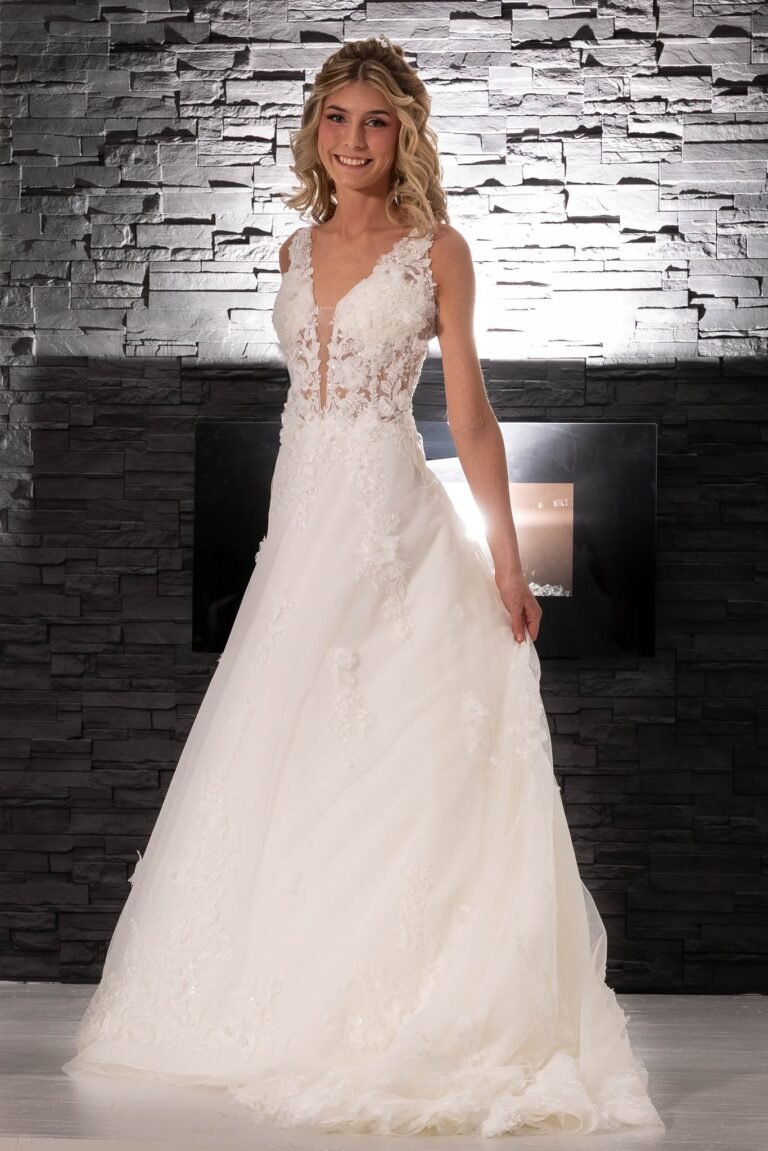 Bride in floral lace appliqué A-line wedding gown at Champagne & Lace Bridal fashion show, Collinsville Illinois